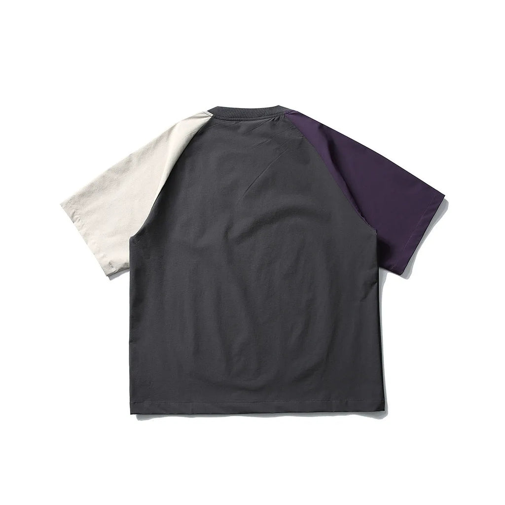 Dark grey men's loose fit t-shirt with light coloured contrast raglan sleeves.