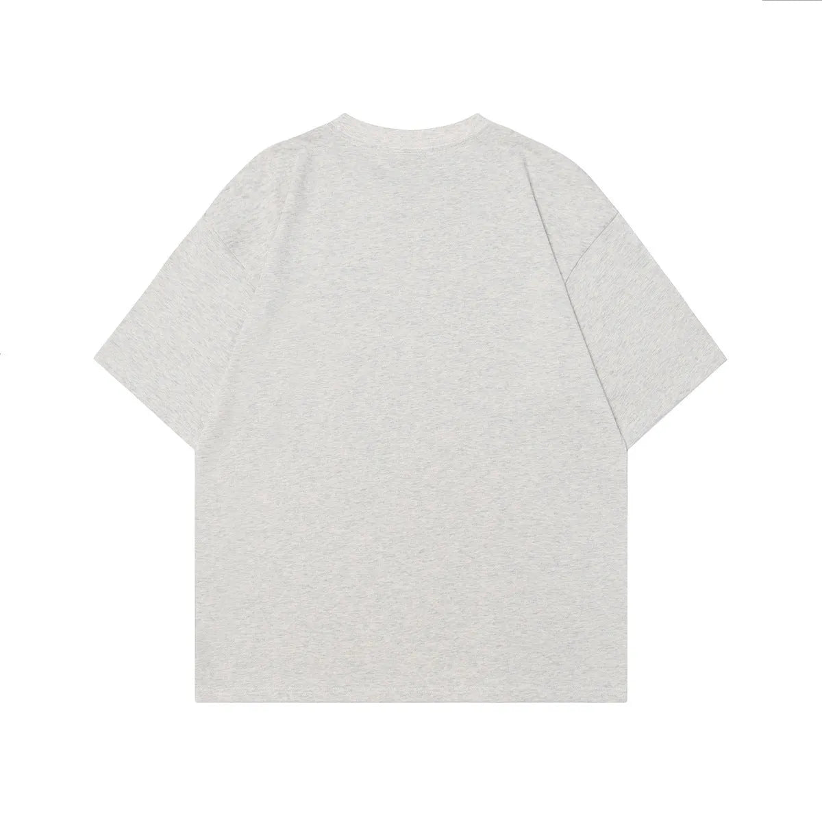 Men's black loose-fit cotton T-shirt featuring a retro character design print on the front.