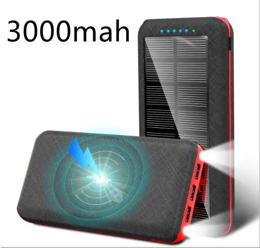 Black portable power bank with Qi wireless charging pad and three USB ports on the side