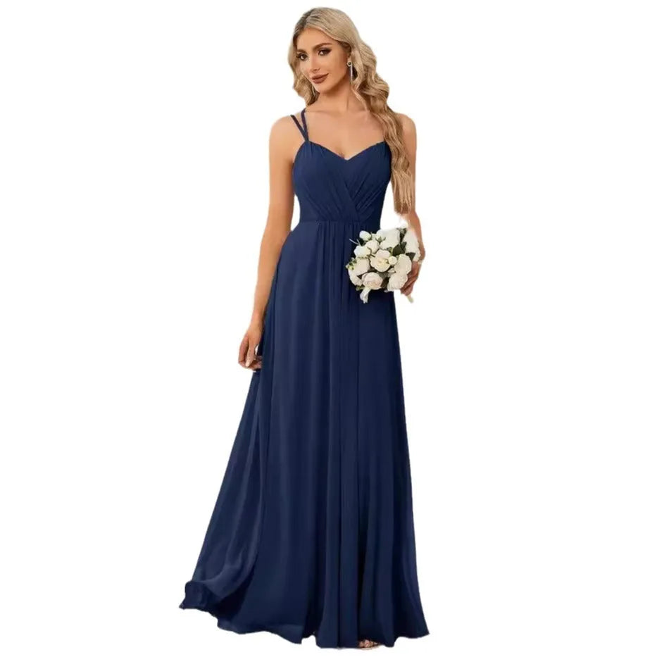 A sleeveless light green women's dress with a pleated A-line long skirt on a mannequin.