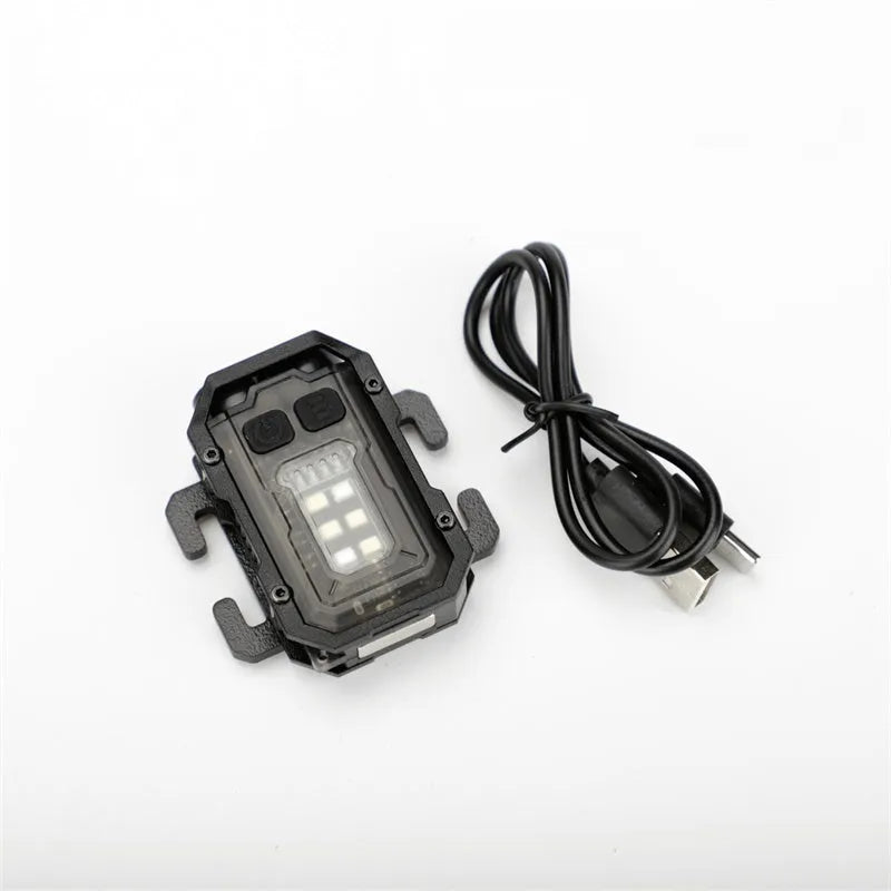 Portable tactical mini warning flashlight with a black housing, showing the LED lens, a side mounting clip, and an included USB charging cable.