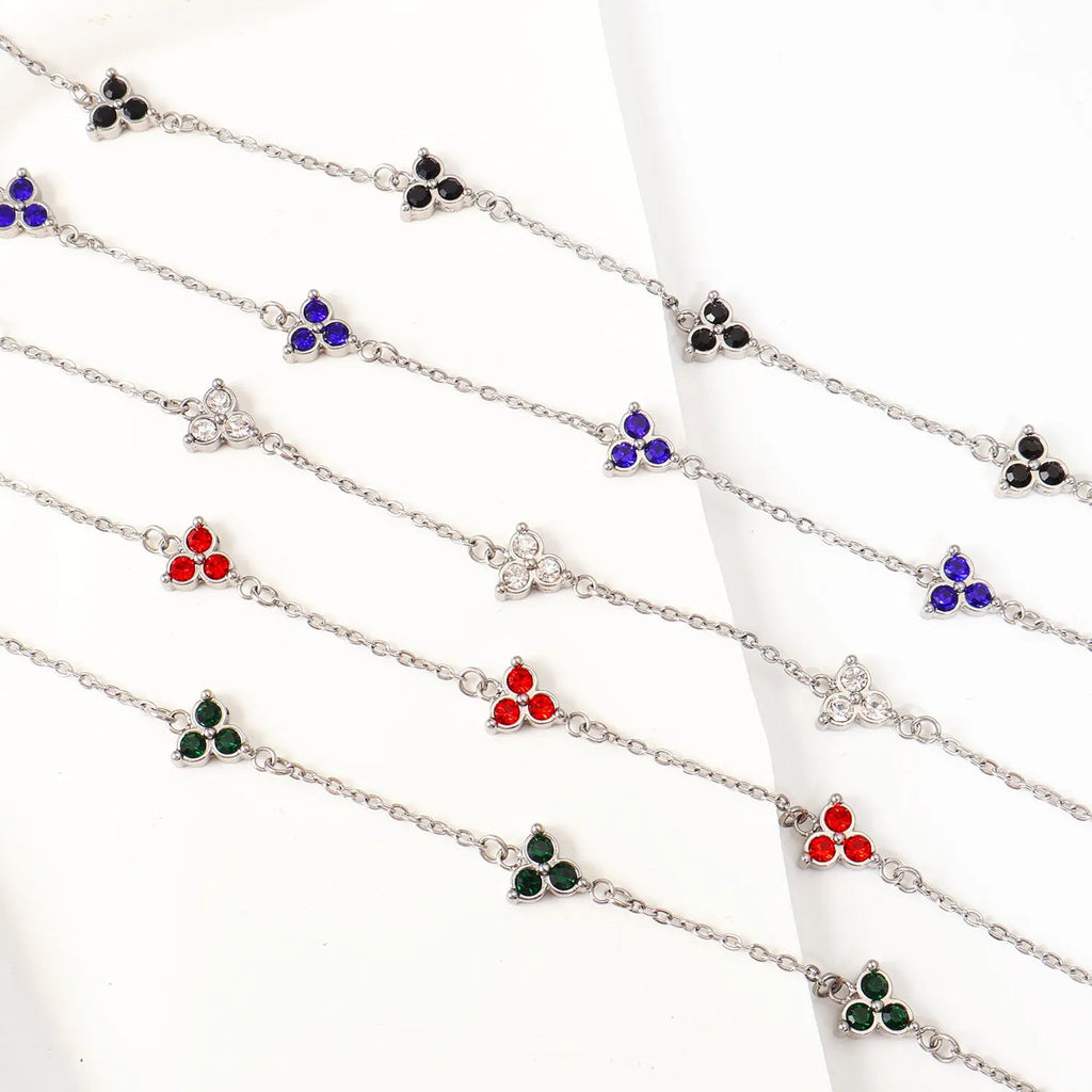 Stainless steel women's bracelet with three geometric diamond shapes and triangle elements