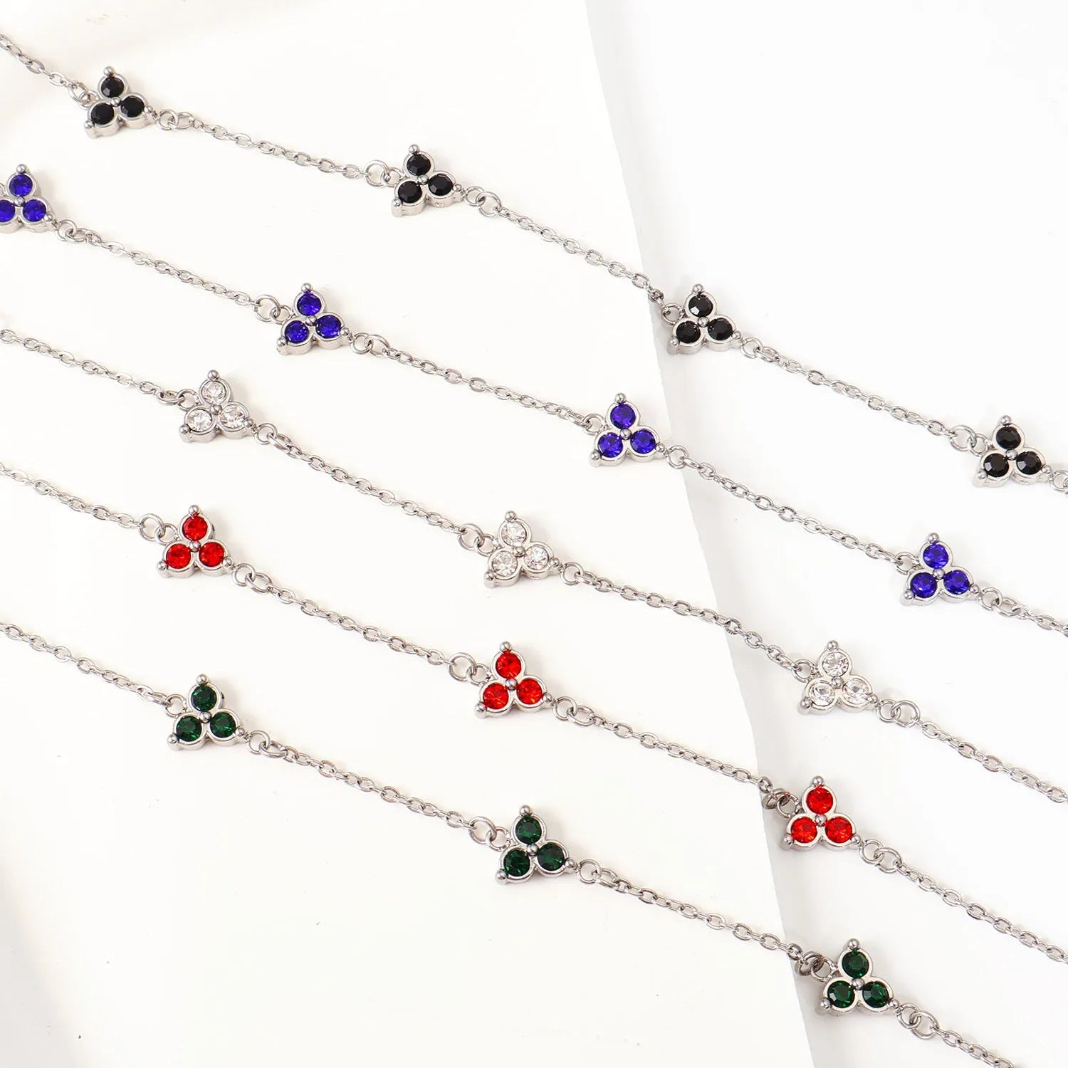 Stainless steel women's bracelet with three geometric diamond shapes and triangle elements
