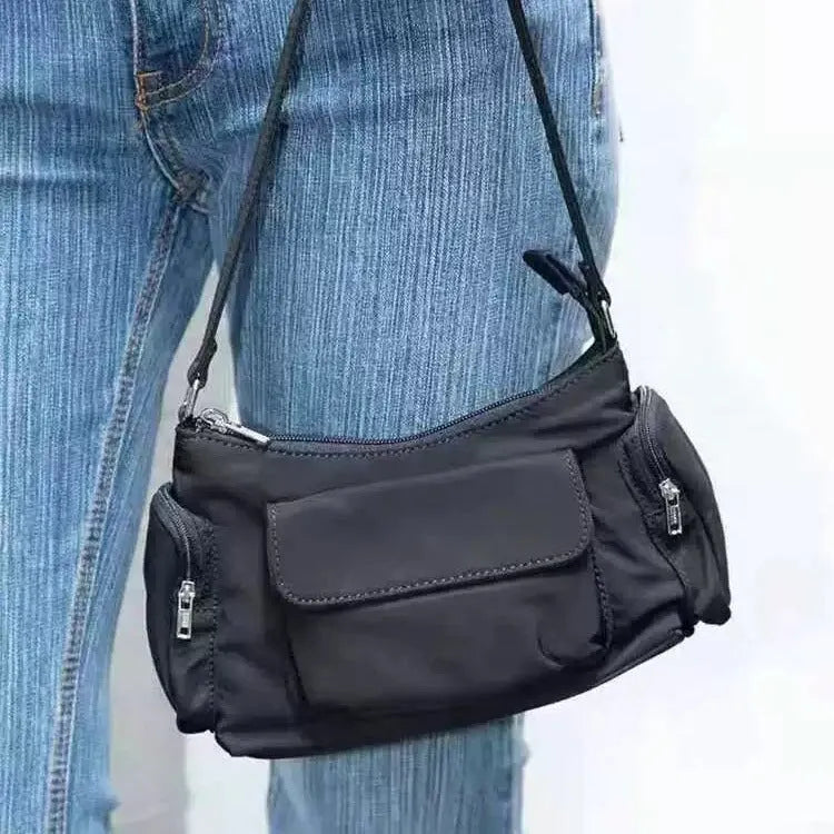 Black nylon unisex shoulder bag with double pockets and side line detail