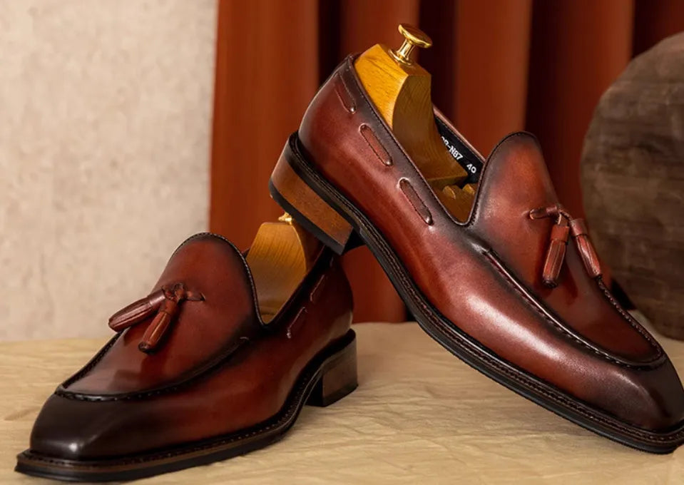 Men's British-style genuine leather slip-on loafers with fringed design in black or brown