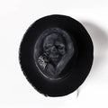 Handmade wool skull hat with conical crown design in Halloween style