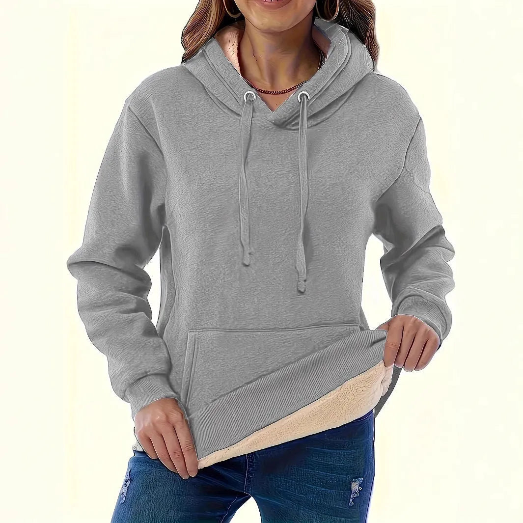 Women's loose fit grey hooded sweatshirt with a 3D textured pattern and a front pocket.