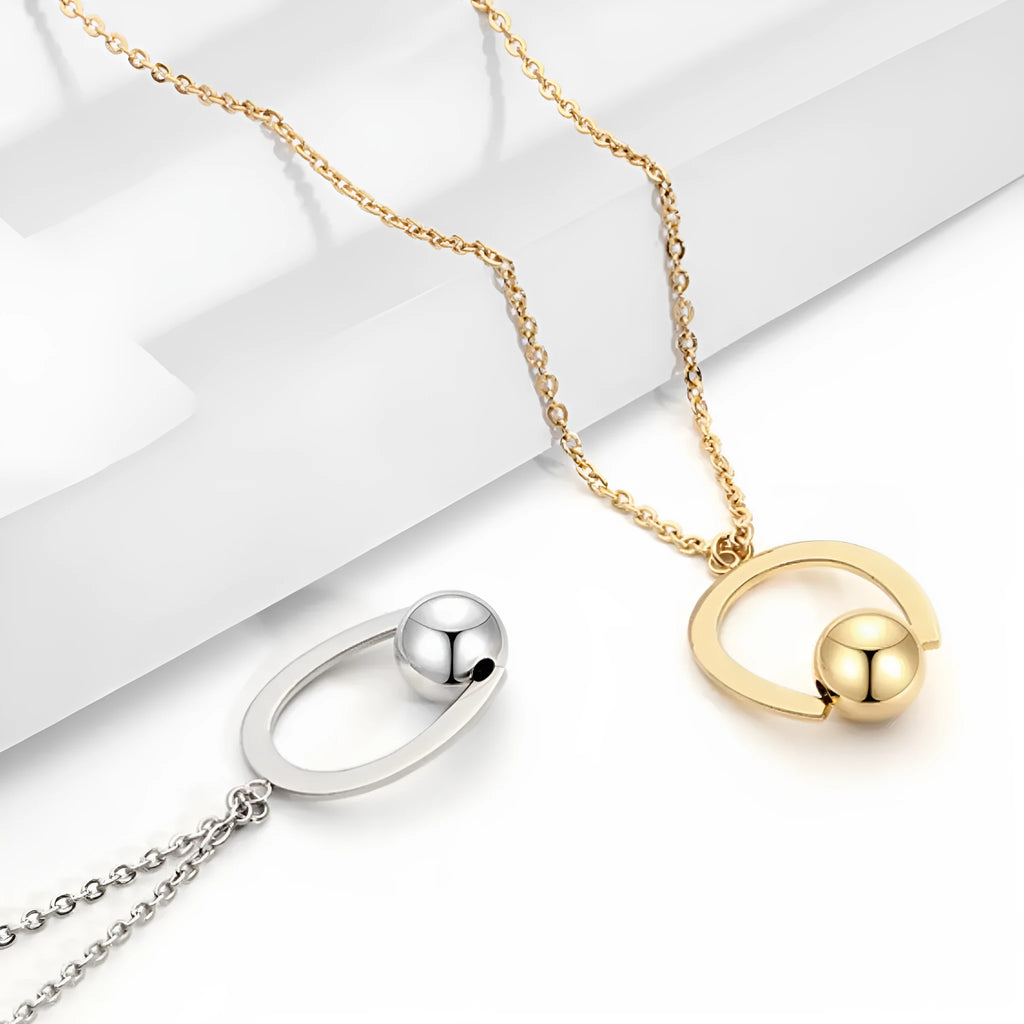 Gold or silver geometric stainless steel necklace on an adjustable cross chain.