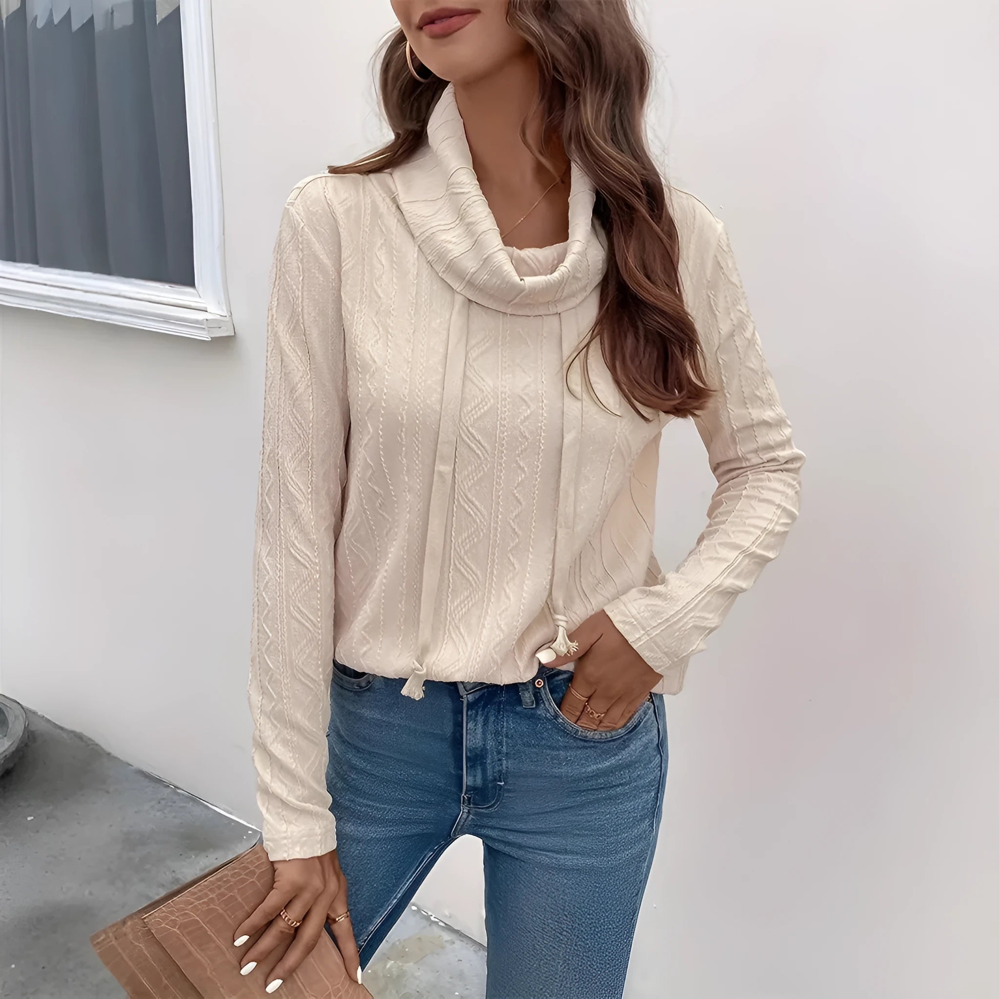 Apricot coloured long sleeve hooded pullover sweater with a drawstring