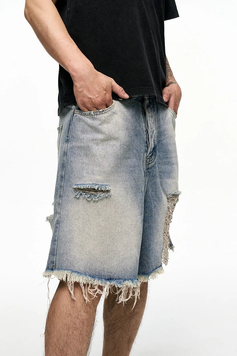 Men's light blue baggy denim shorts with a retro washed finish on a mid-waist