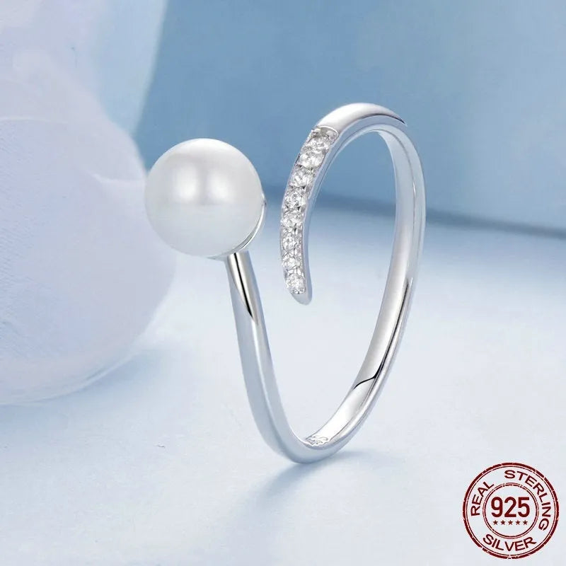 Adjustable open loop sterling silver ring with natural shell pearl in 8 US sizing