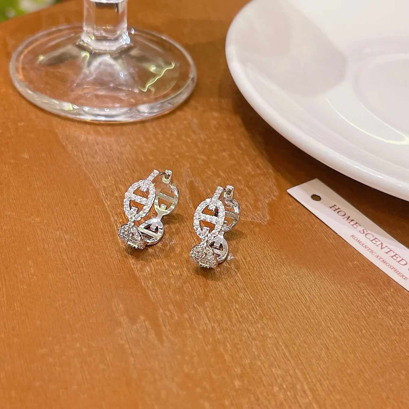 A pair of electroplated copper earrings with a diamond design in a choice of silver, gold, or rose gold thick plating.