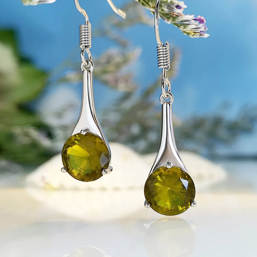 Olive green topaz drop earrings with water shape design and retro style on alloy background