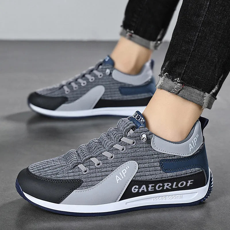 Men's grey and green mesh running shoes with low-top design and lace-up closure