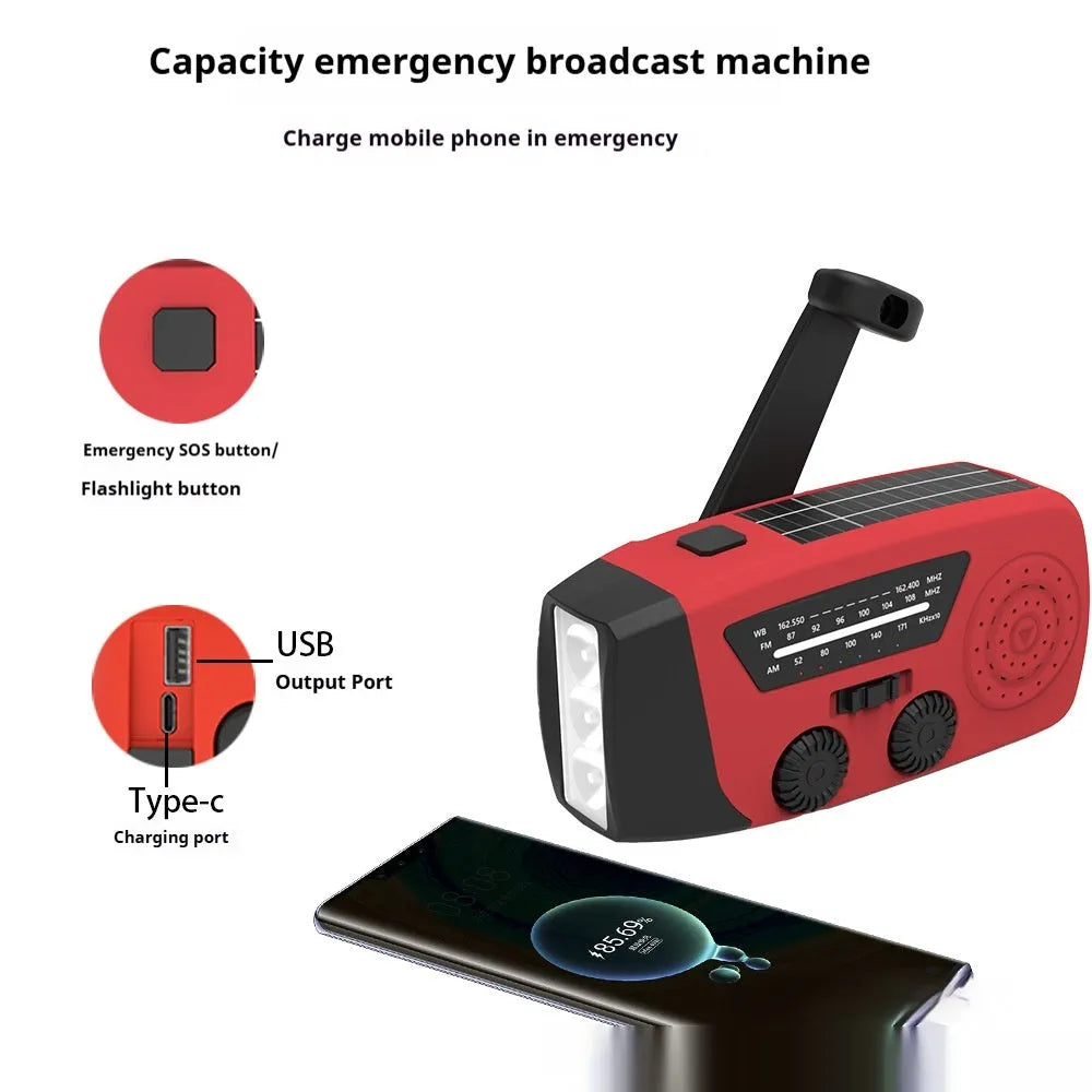 Red rechargeable emergency radio torch with hand crank, LED light, and USB charging port