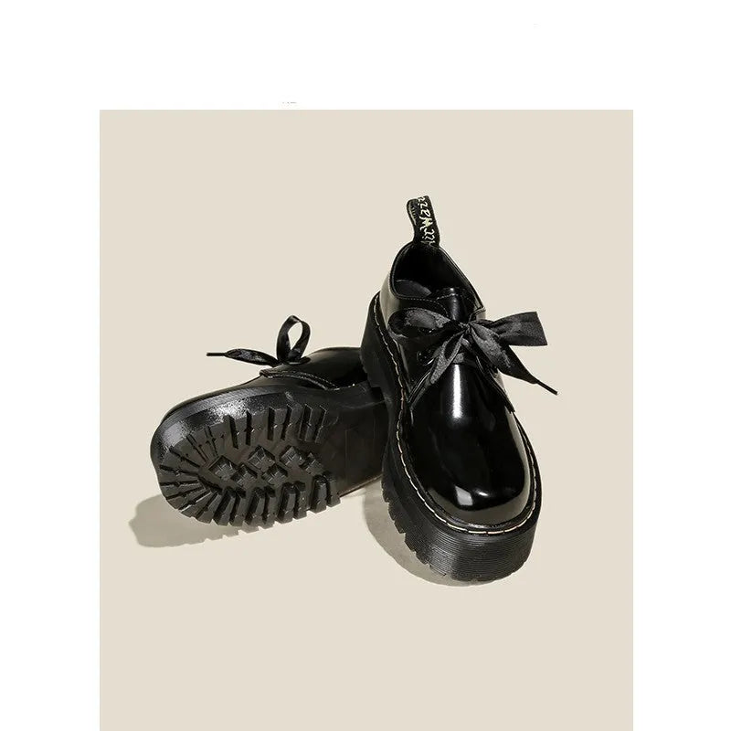 Women's thick soled leather shoes with ribbon details in black and white colour options