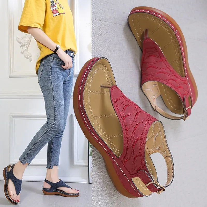 Women's casual wedge-heel sandals with adjustable buckle strap in a solid colour.