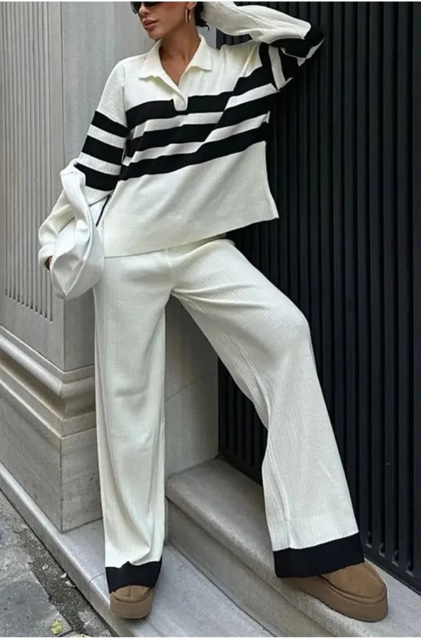 Women's black and white striped knitted two-piece set with polo collar shirt and matching trousers
