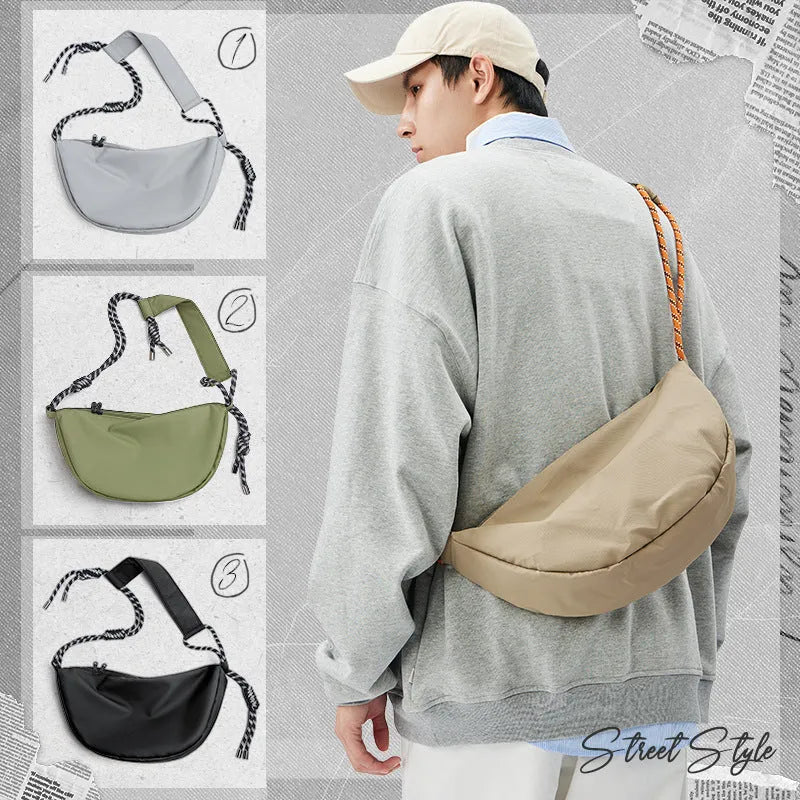 Men's nylon messenger backpack in black colour showing large capacity interior and lightweight construction