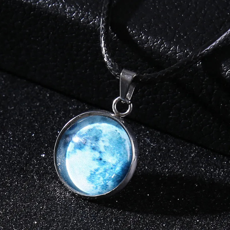 Luminous moon and constellation pendant necklace on a chain with an extension, shown in one of ten possible colours.
