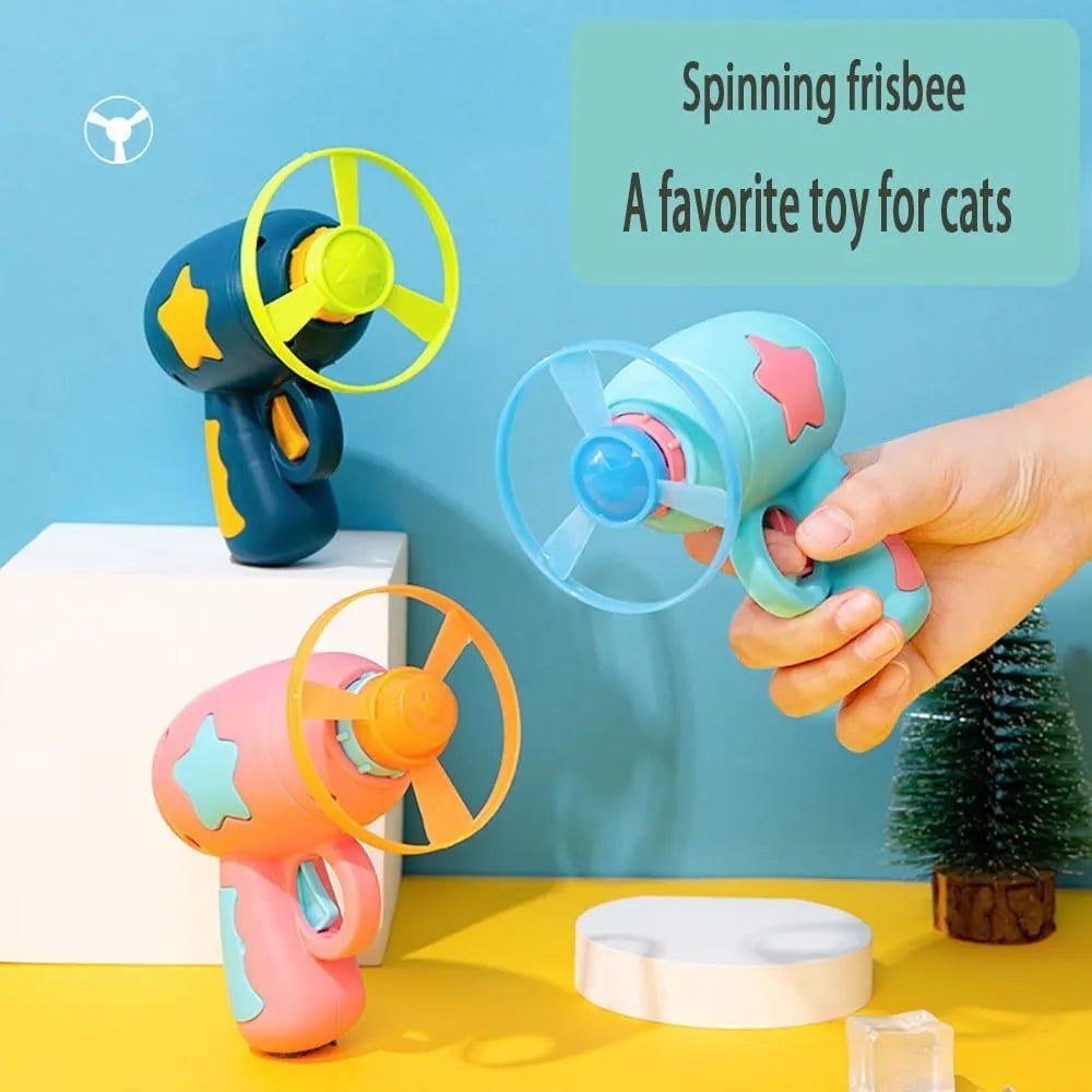 Blue interactive cat toy gun with spinning plastic frisbee for indoor cat play sessions