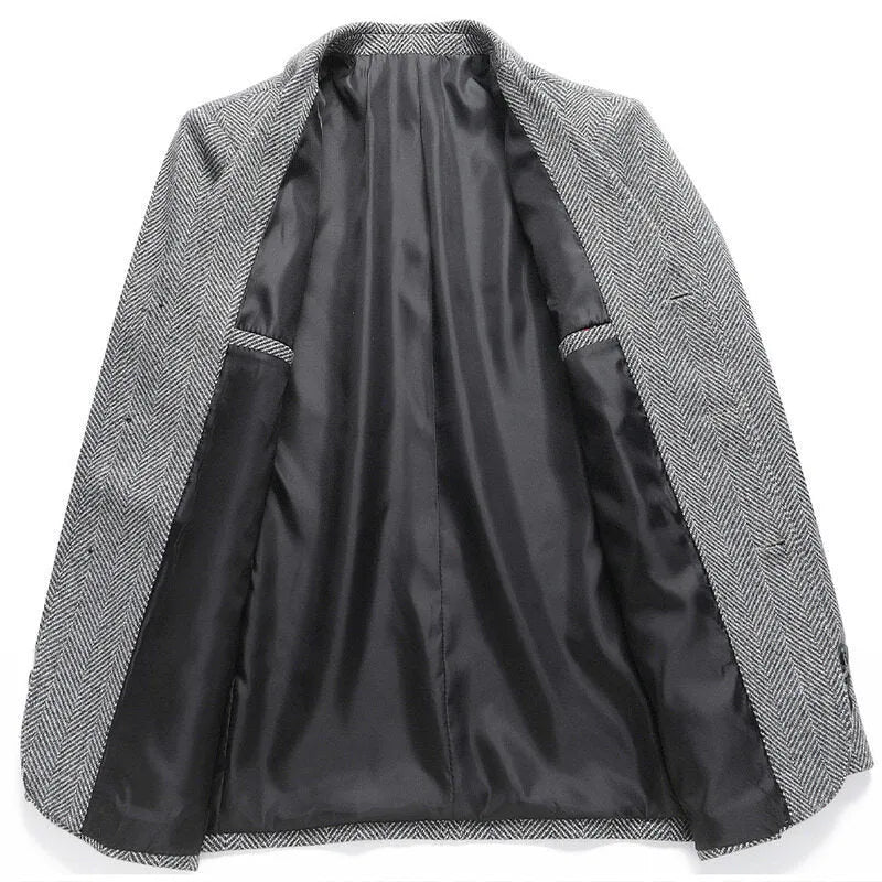 Man wearing a loose fit black woolen coat for casual spring or autumn leisure wear.