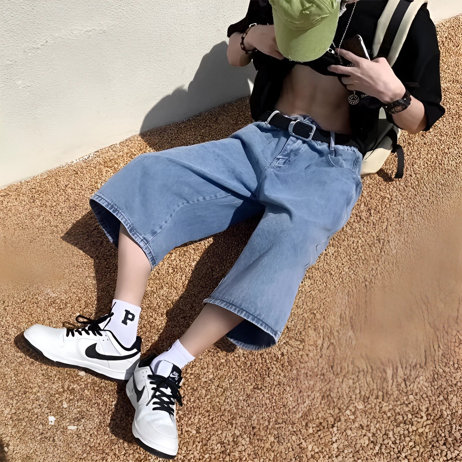 Men's blue high-waisted denim pirate shorts with a cropped, straight leg and zipper fly.