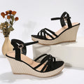 Women's beige wedge sandals with a fish mouth toe opening and cloth upper.