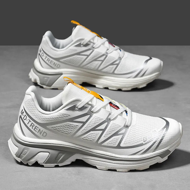 Men's and women's low-top black and grey hiking shoes with rubber sole and lace-up front.
