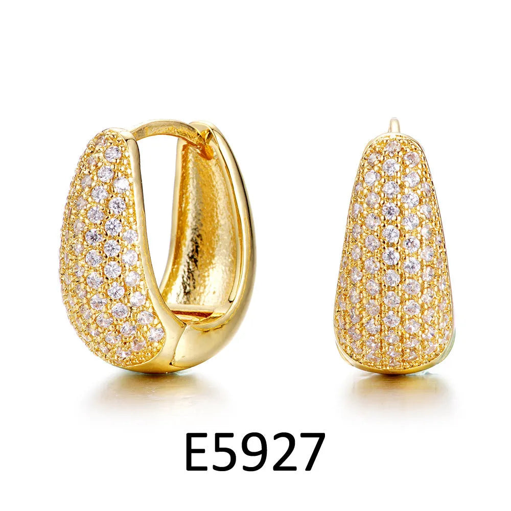 Gold plated heart-shaped zircon ear clip earrings for women on a white background