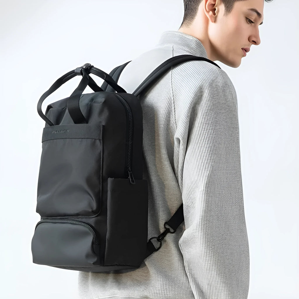 Elegant black Oxford cloth laptop backpack with 20-35 litre capacity and polyester lining