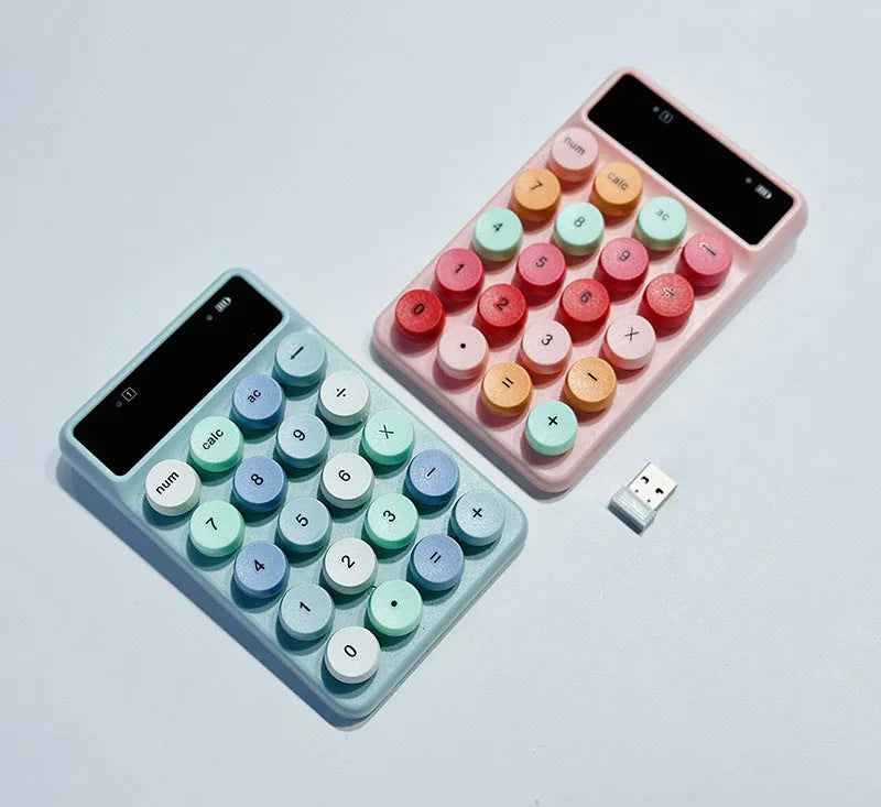 Mini portable wireless keyboard in macaron mixed colours on a desk.