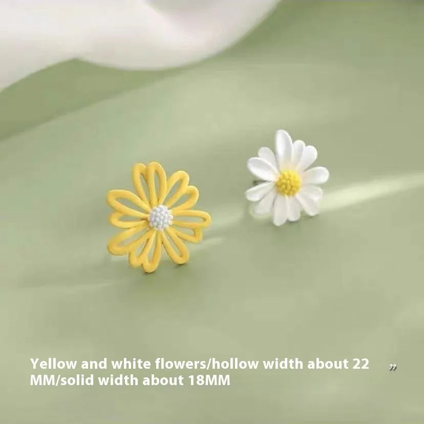 A pair of cartoon-style flower stud earrings made from alloy, showing a blue and orange two-tone colour variation.