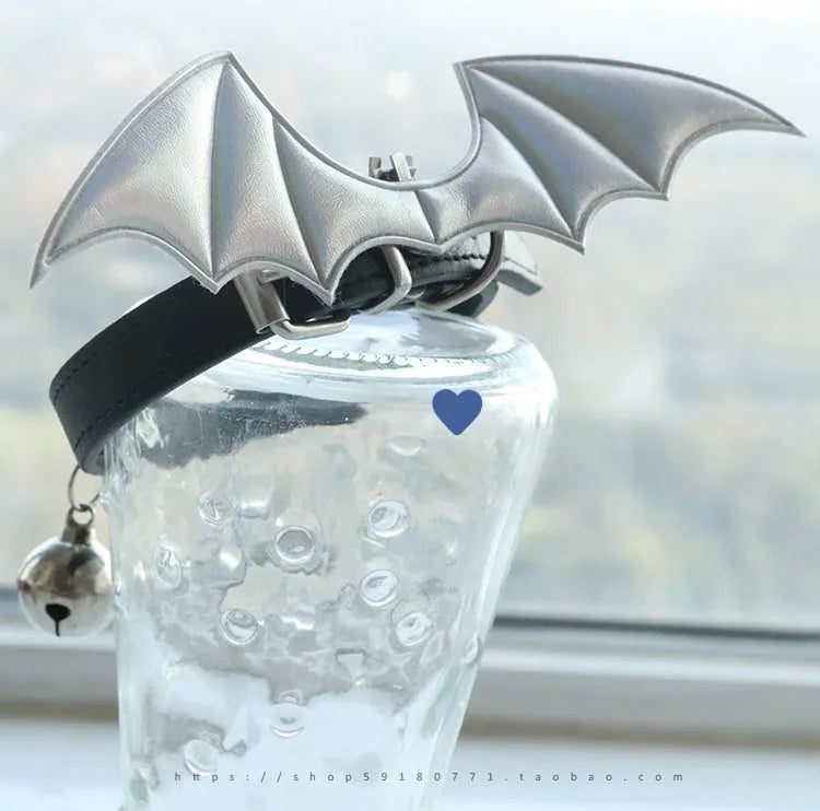 Black patent leather choker collar with devil wings design and bell attachment