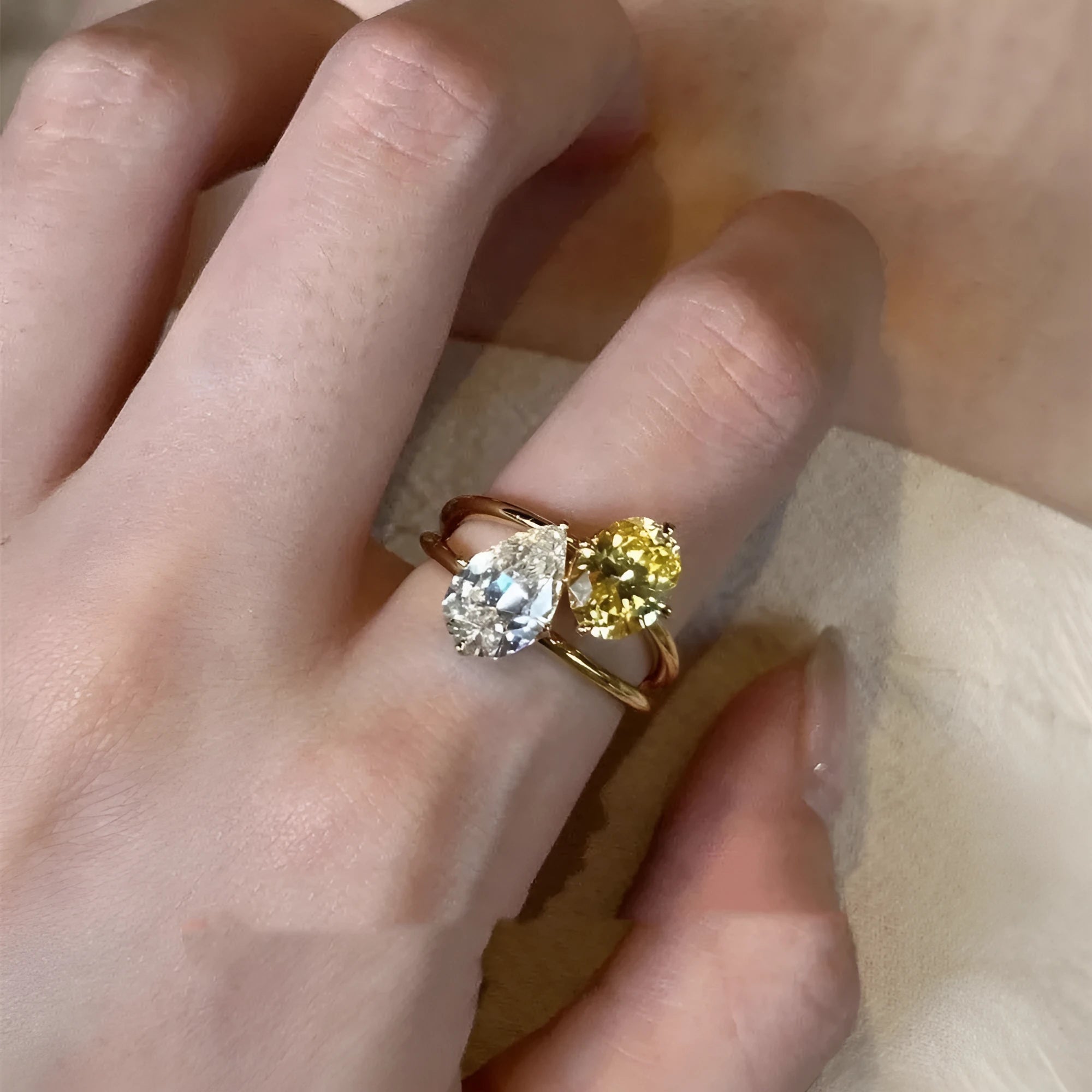 Water drop double Sheng stone copper ring with geometric open design and zircon detailing