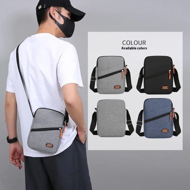 Lightweight solid colour oxford cloth crossbody commuter bag in black, navy, or silver grey.