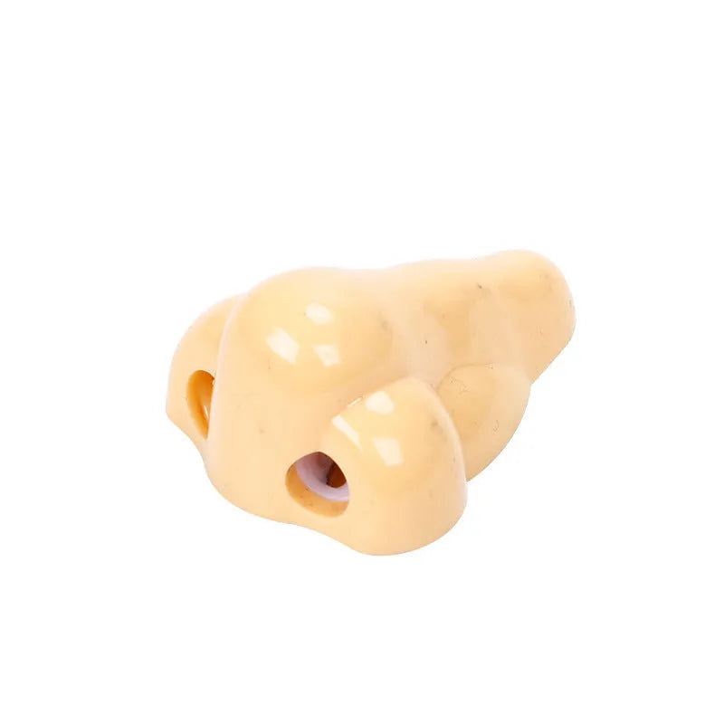 Flesh coloured geometry-shaped plastic pencil sharpener with big nostril opening