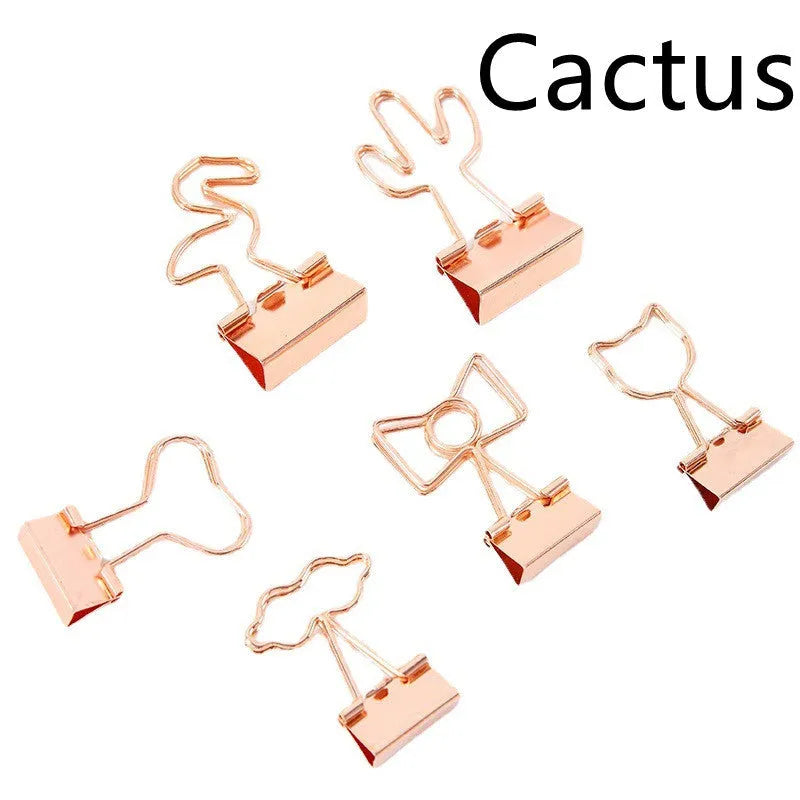 Gold metal paper clip with decorative charm attachment in flamingo design
