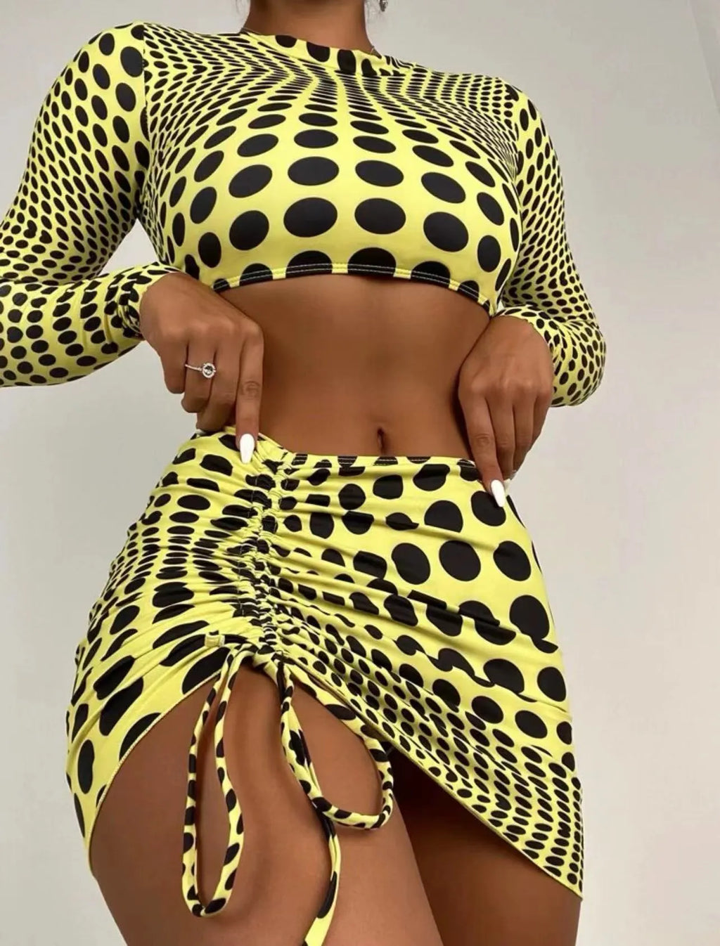 Women's green polka dot three-piece swimsuit set with skirt and padded bikini top