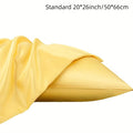 A pair of solid-colour satin pillowcases in polyester fibre, shown in one of thirteen available colours.