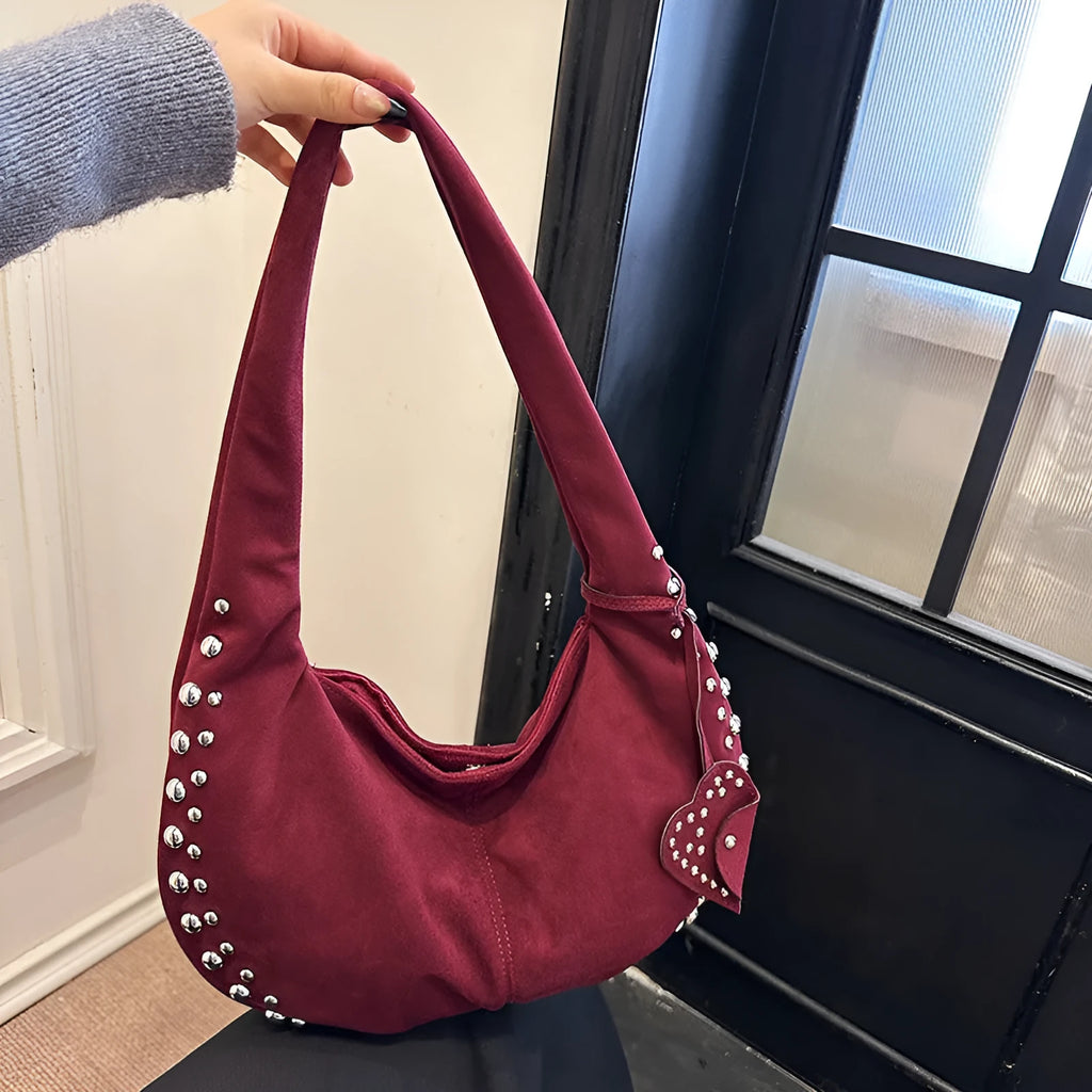 A soft plush retro style tote handbag for women in a strapless design, shown in a choice of colours.