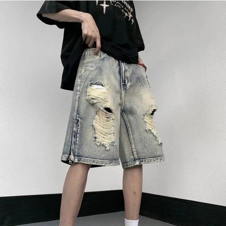 Blue retro denim shorts with tattered detailing and a wide leg loose fit