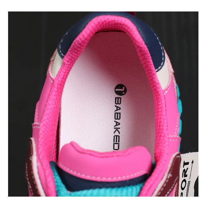 A pair of thick-soled leather casual shoes with a wedge heel and lace-up front fastening.