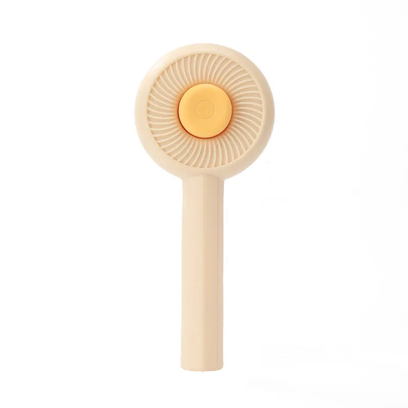 Blue and yellow pet grooming brush with metal pins and a self-cleaning button on the handle.