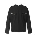 Man wearing a loose-fitting black long sleeve cotton t-shirt with a retro casual style.