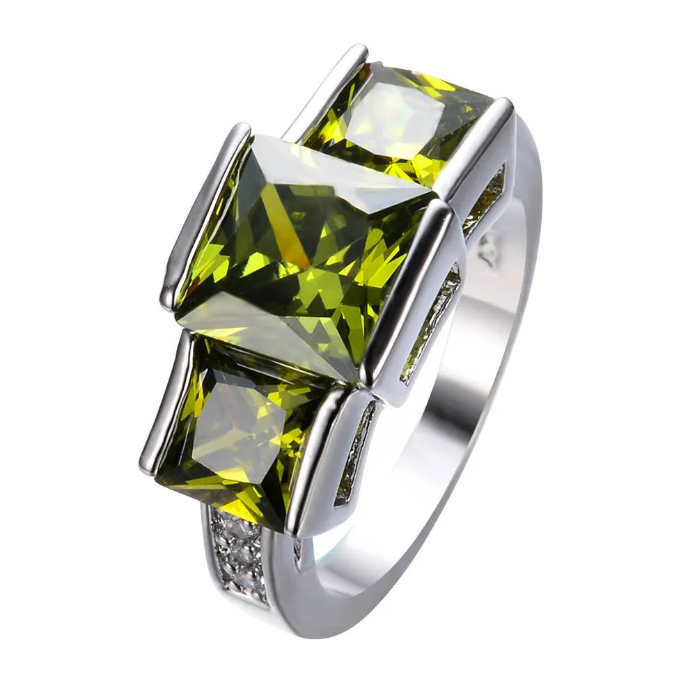 A geometric copper ring in multiple colour options on a size chart showing rings 6 to 10.