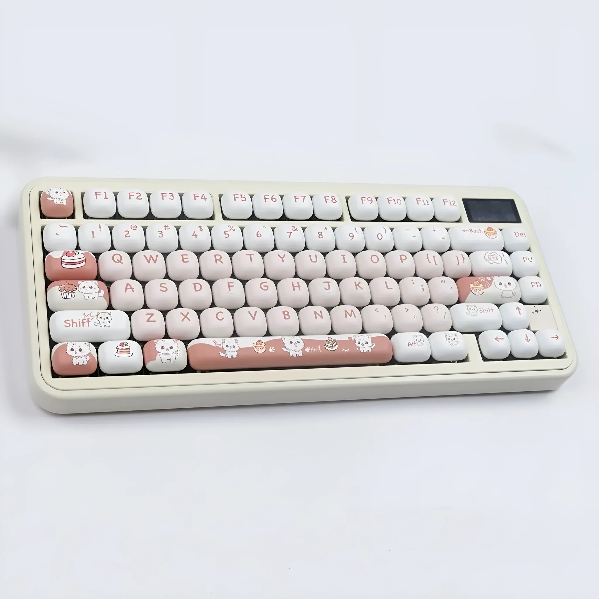 Close-up of a rounded mechanical keyboard key cap with a colourful cartoon dessert cat character print.