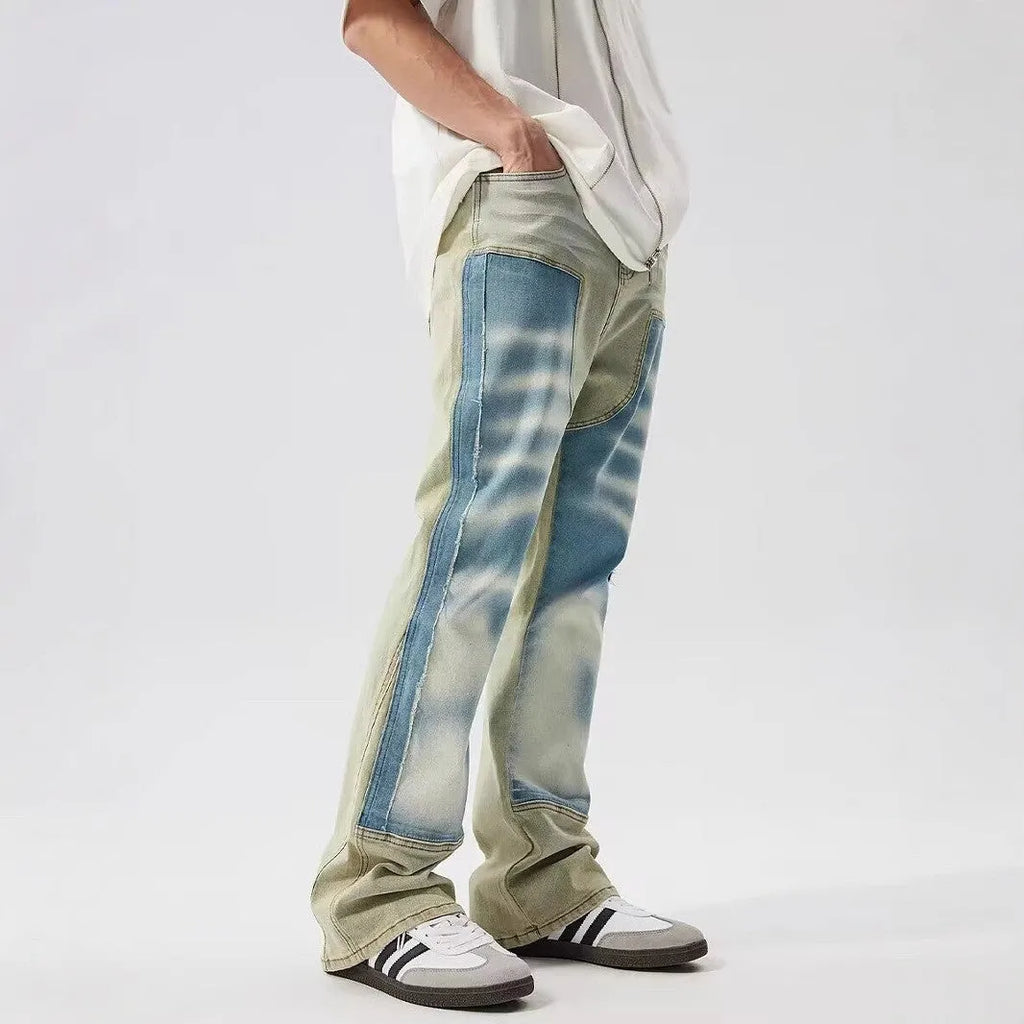 Retro dual-colour patchwork jeans with splash-ink damaged design in yellow and blue
