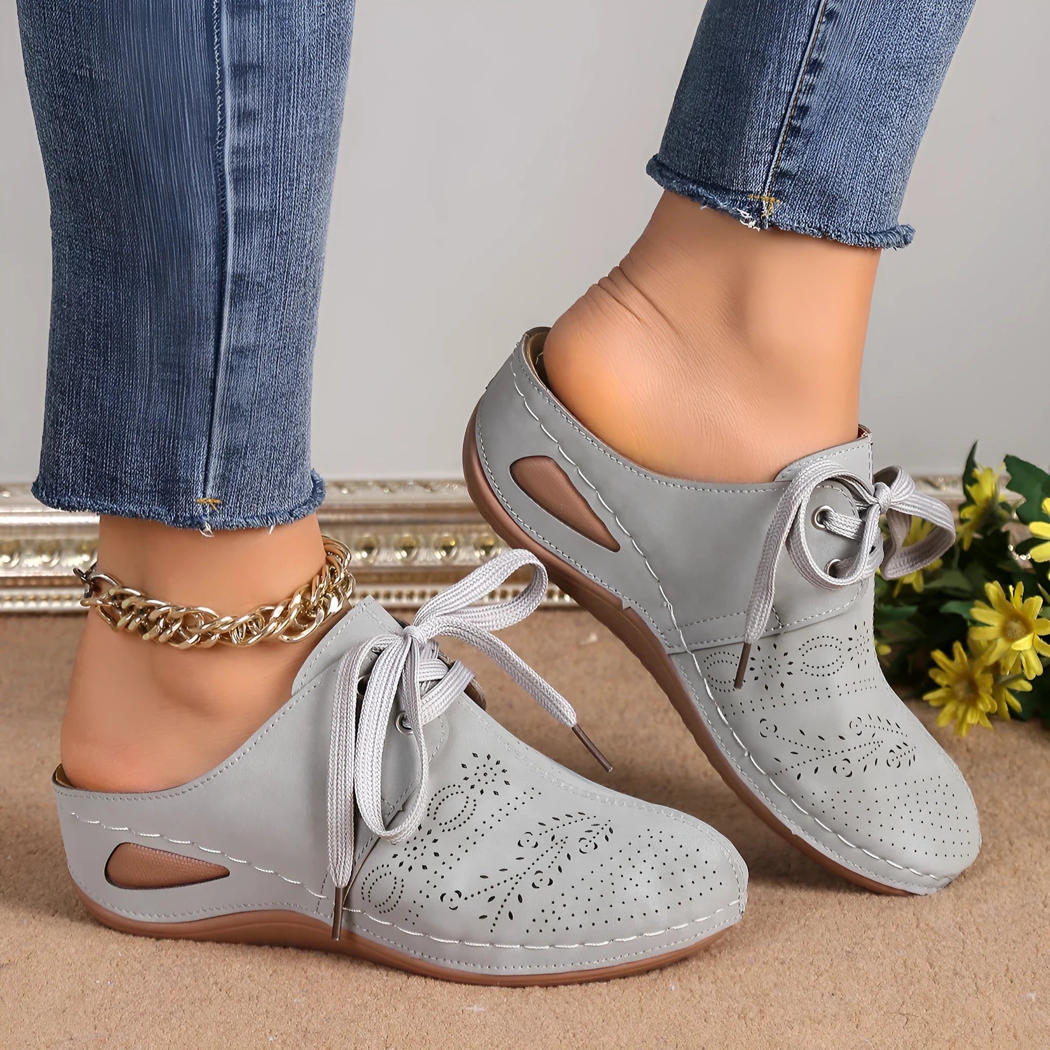 Women's summer baotou lace-up slippers with hollow-out wedge sole in a light grey colour.