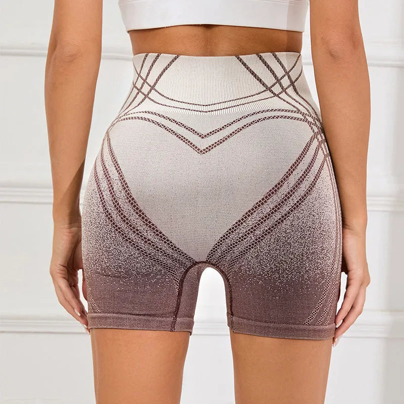 Women's brown gradient high waisted fitness shorts laid flat, showing nylon blend lining.
